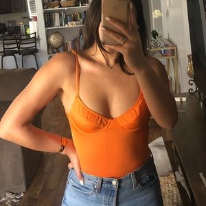 Neon orange body suit